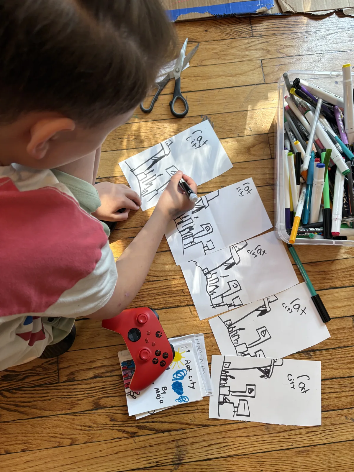 Student drawing a comic spread with markers