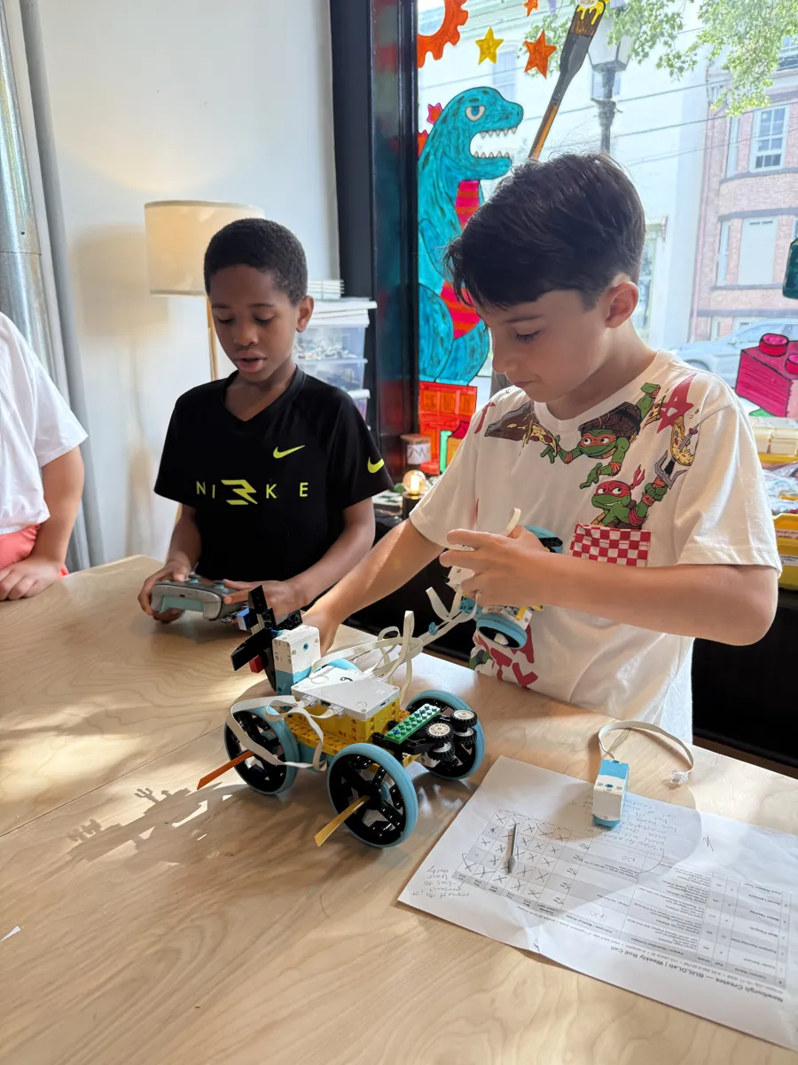 Students fine-tuning their robot