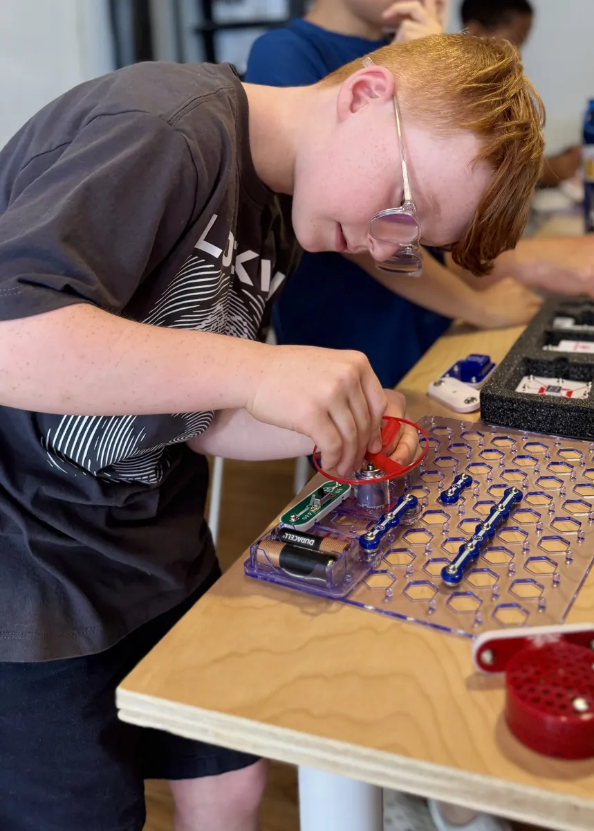 Student wiring a circuit build