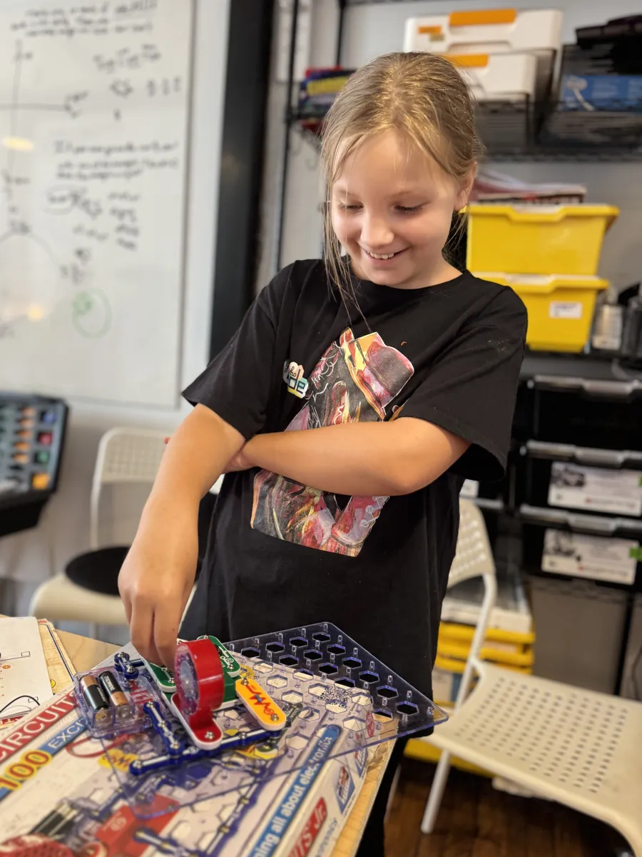 Student showing off her finished build