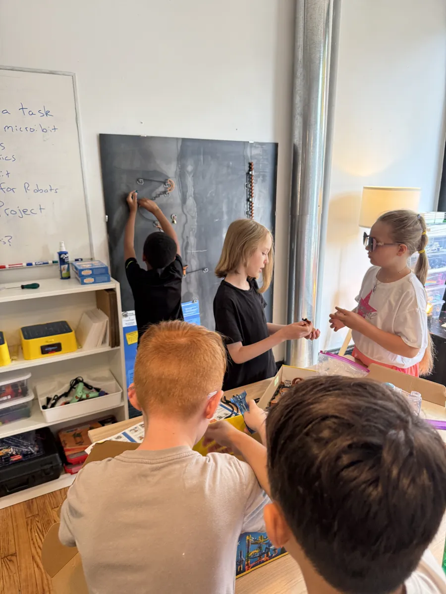 Students building on the magnetic wall