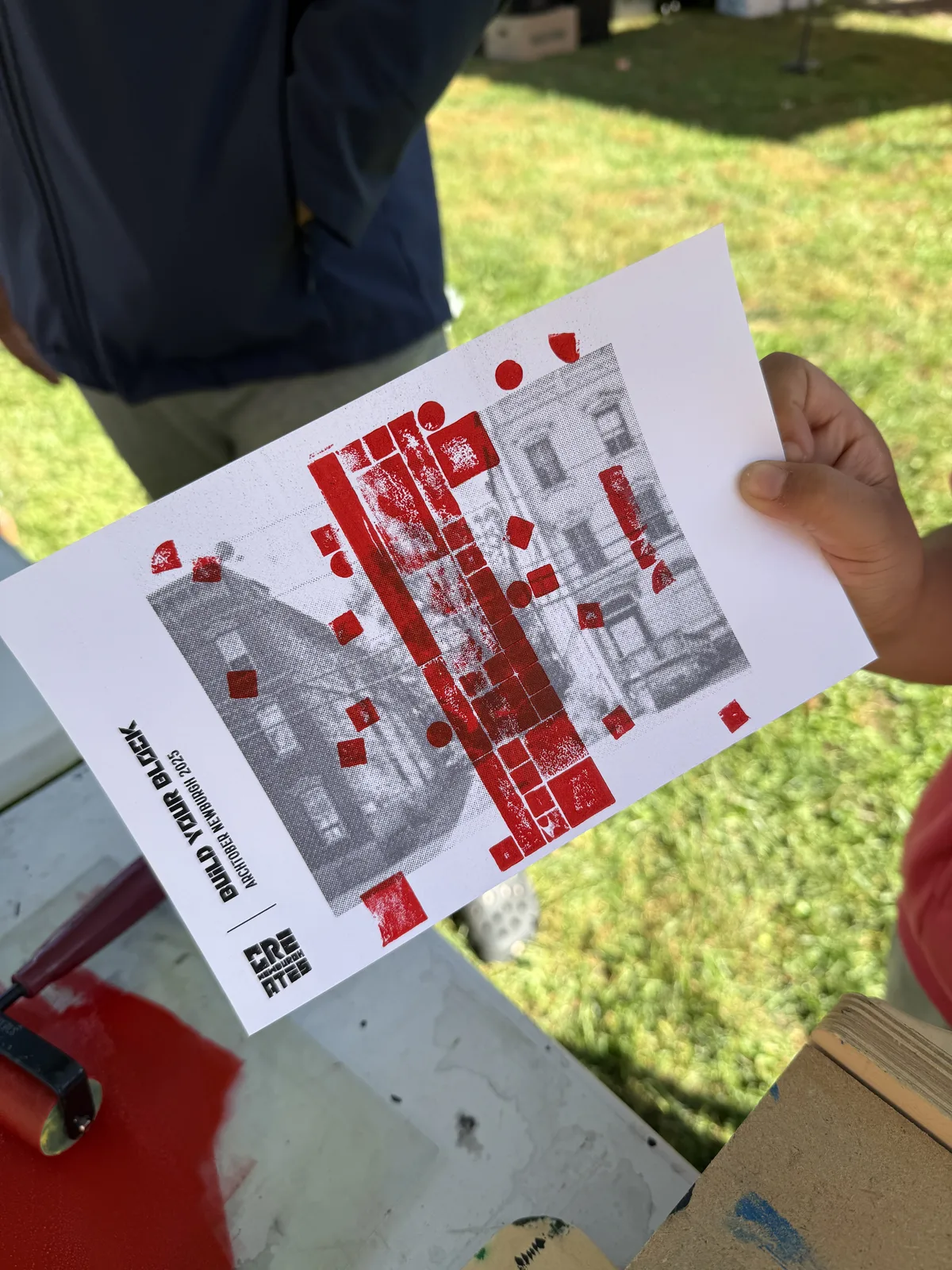 Student holding a finished two-color print