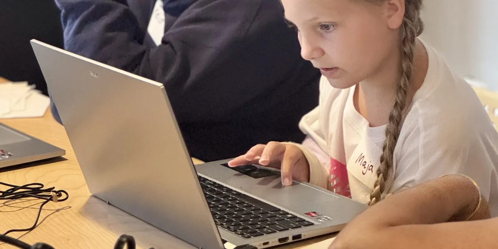 A camper coding on a laptop
