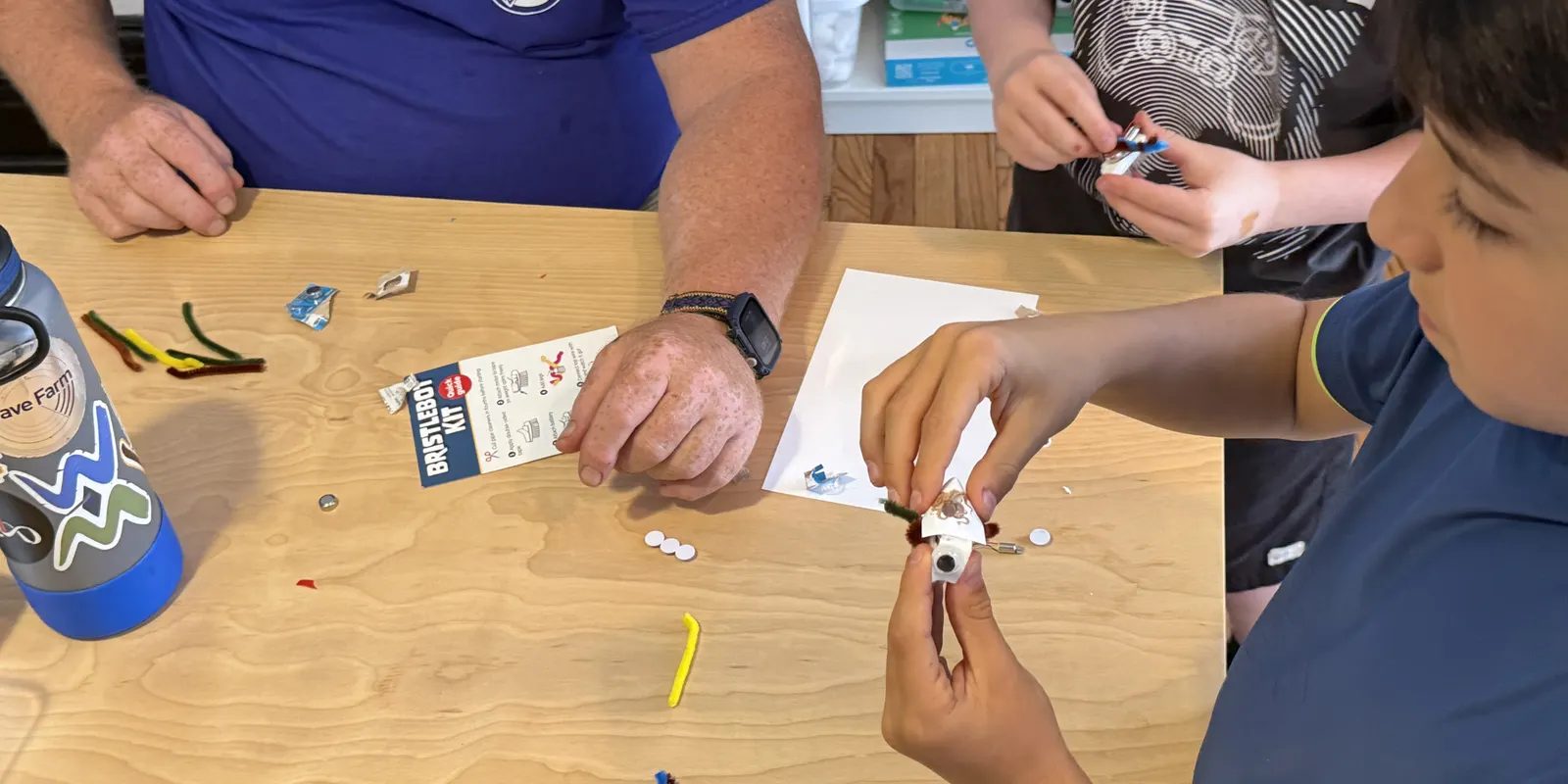 Campers wiring a small electronics kit